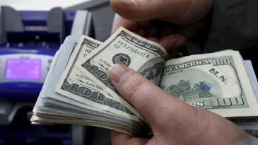 Sahte 20 bin doları bankada bozdurmak isterken yakalandı