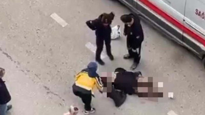 Yolun ortasında yatan kadın, sinir krizi geçirdi